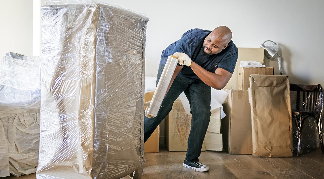 Professional mover moving dresser