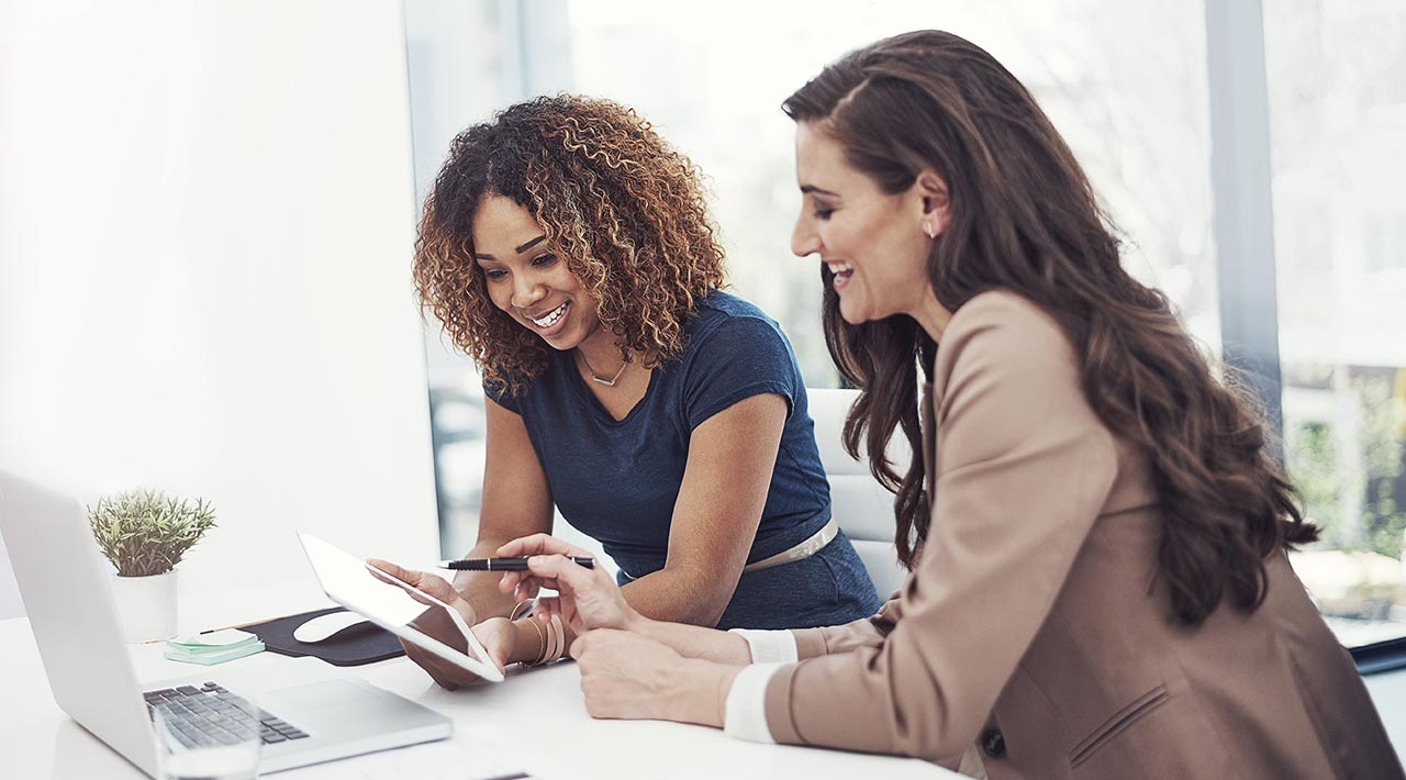 Women planning at desk