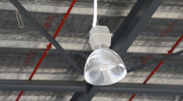 Industrial light fixture hanging from ceiling